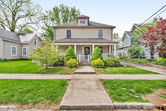 traditional style home with a porch and a front lawn