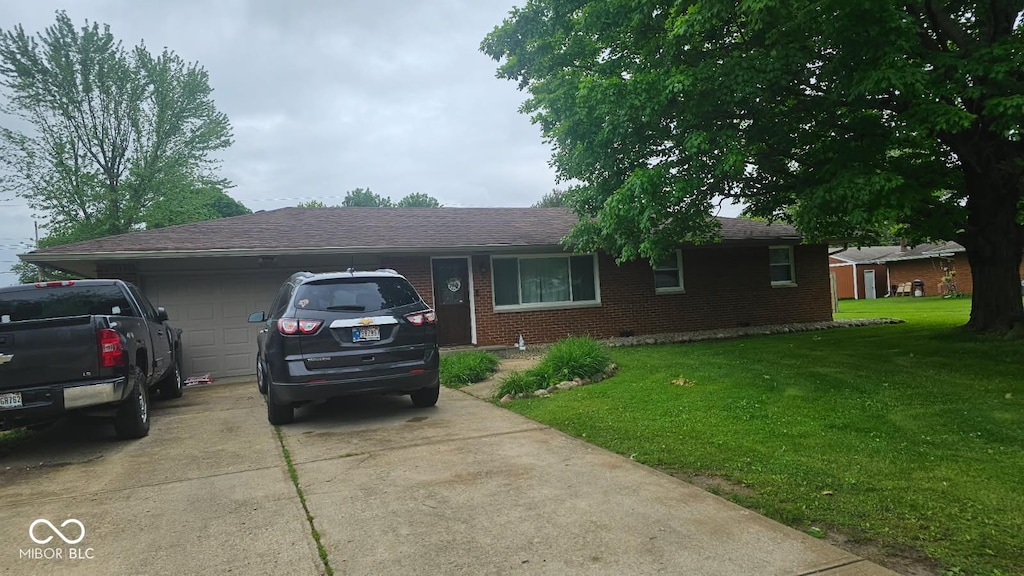 5805 S Gale St, Indianapolis, IN 46227 - single story home featuring driveway, an attached garage, brick siding, a front yard, and roof with shingles
