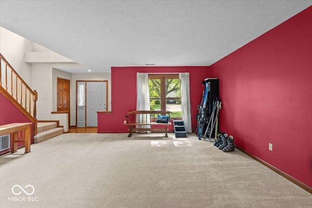14814 Beacon Blvd, Carmel, IN 46032 - exercise area with carpet floors, baseboards, and a textured ceiling