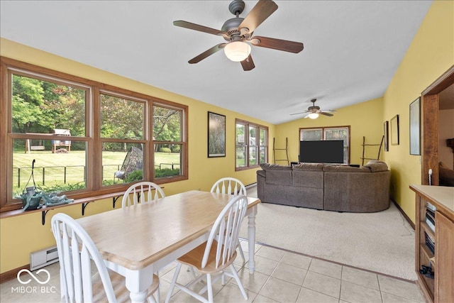 14814 Beacon Blvd, Carmel, IN 46032 - dining area featuring light carpet, vaulted ceiling, ceiling fan, light tile patterned floors, and baseboard heating
