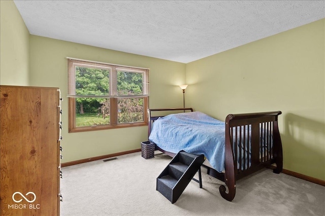 14814 Beacon Blvd, Carmel, IN 46032 - carpeted bedroom featuring baseboards and a textured ceiling