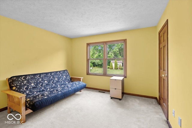 14814 Beacon Blvd, Carmel, IN 46032 - living area featuring baseboards, light colored carpet, and a textured ceiling