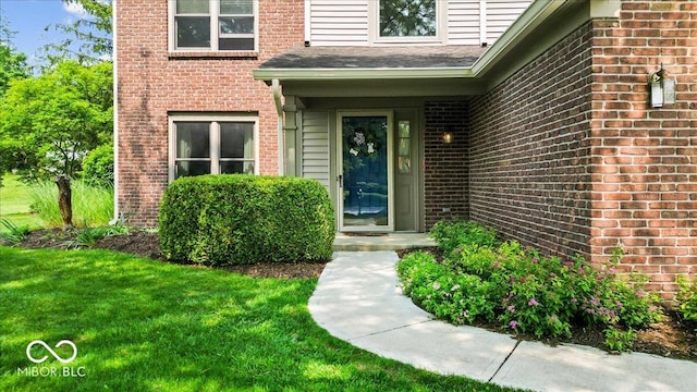 14814 Beacon Blvd, Carmel, IN 46032 - doorway to property with brick siding and a yard
