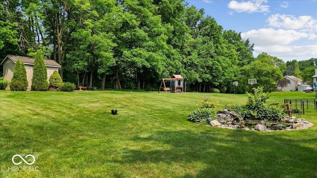 14814 Beacon Blvd, Carmel, IN 46032 - view of grassy yard featuring a playground