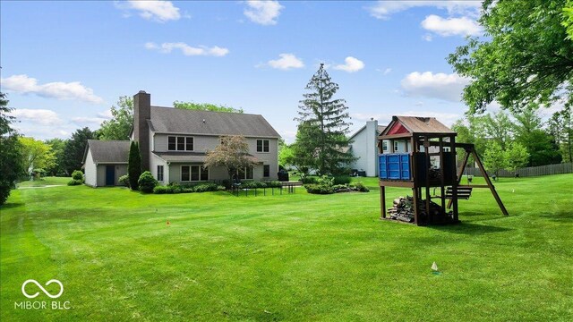 14814 Beacon Blvd, Carmel, IN 46032 - view of green lawn featuring a playground