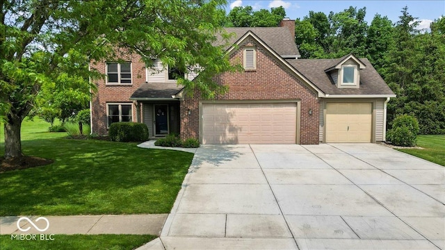 14814 Beacon Blvd, Carmel, IN 46032 - traditional-style house featuring driveway, a front lawn, brick siding, and a shingled roof