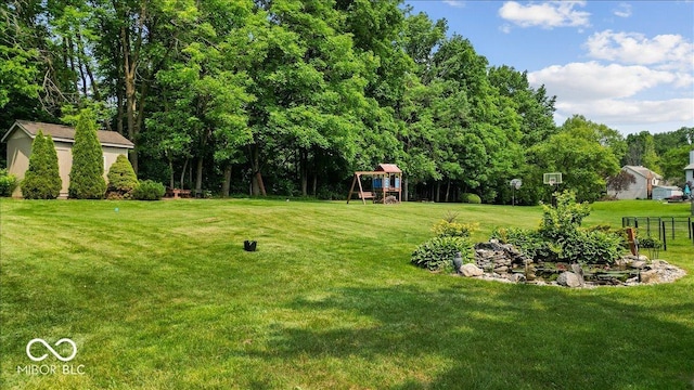 14814 Beacon Blvd, Carmel, IN 46032 - view of grassy yard with a playground