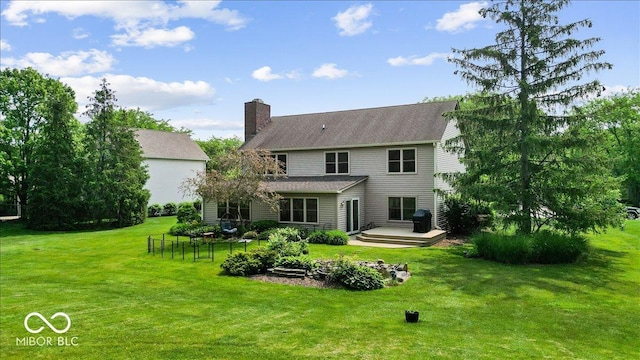 14814 Beacon Blvd, Carmel, IN 46032 - back of house featuring a chimney and a wooden deck