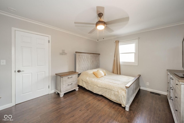 433 N 15th Ave, Beech Grove, IN 46107 - bedroom featuring dark wood finished floors, crown molding, baseboards, and ceiling fan