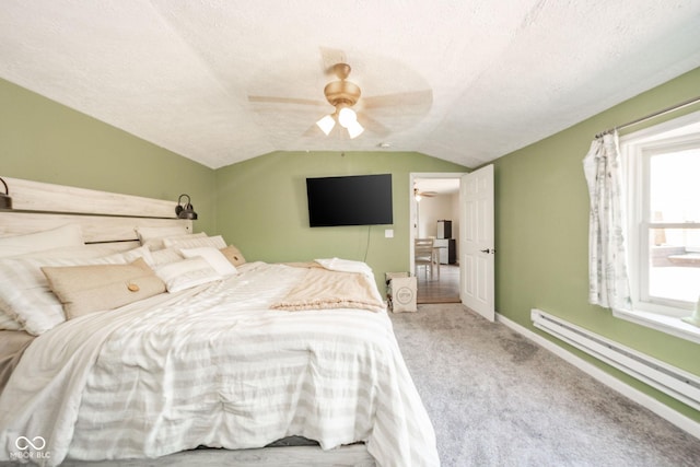 433 N 15th Ave, Beech Grove, IN 46107 - carpeted bedroom featuring a baseboard heating unit, lofted ceiling, a textured ceiling, a ceiling fan, and baseboards