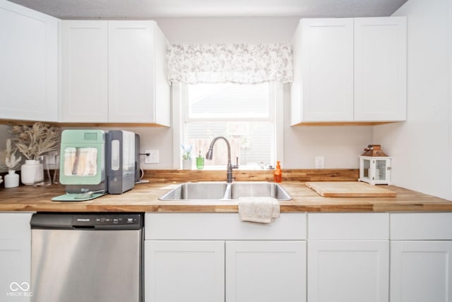 433 N 15th Ave, Beech Grove, IN 46107 - kitchen with stainless steel dishwasher, a sink, butcher block counters, and white cabinetry
