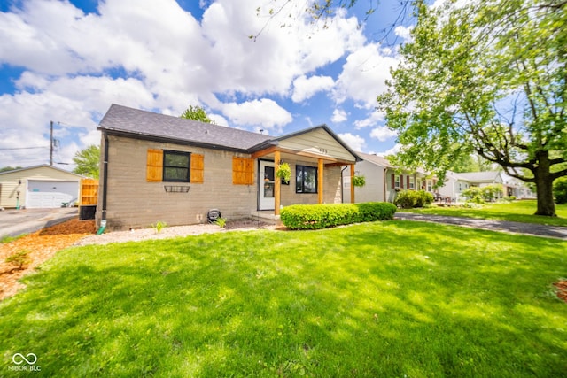 433 N 15th Ave, Beech Grove, IN 46107 - ranch-style home with a front yard, an outbuilding, and brick siding