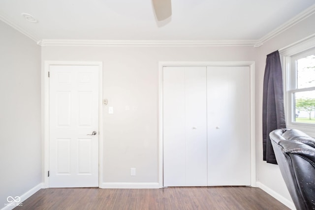433 N 15th Ave, Beech Grove, IN 46107 - bedroom with crown molding, baseboards, dark wood-style floors, a closet, and ceiling fan