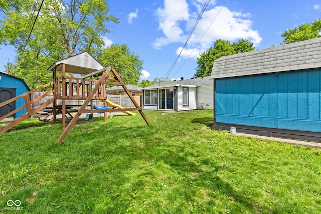 5115 Bertha St, Indianapolis, IN 46241 - view of yard featuring a playground and a sunroom