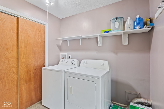 5115 Bertha St, Indianapolis, IN 46241 - laundry area with separate washer and dryer and a textured ceiling