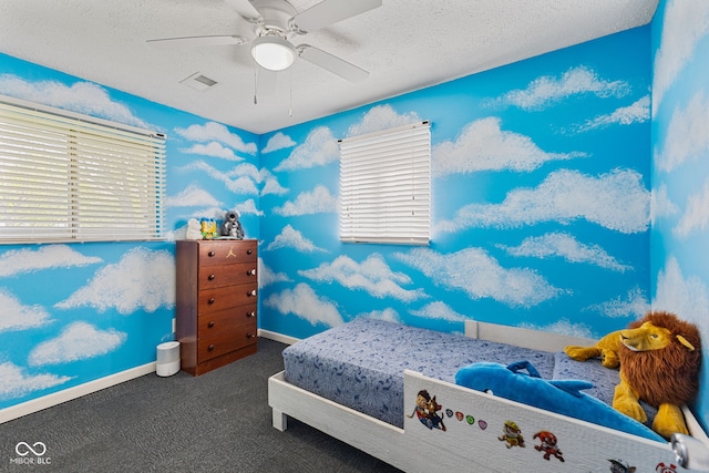 5115 Bertha St, Indianapolis, IN 46241 - carpeted bedroom with ceiling fan, multiple windows, baseboards, and a textured ceiling