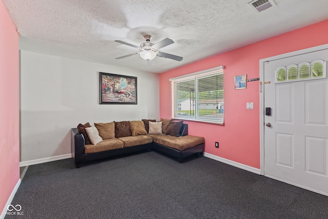 5115 Bertha St, Indianapolis, IN 46241 - living room featuring dark carpet, ceiling fan, baseboards, and a textured ceiling