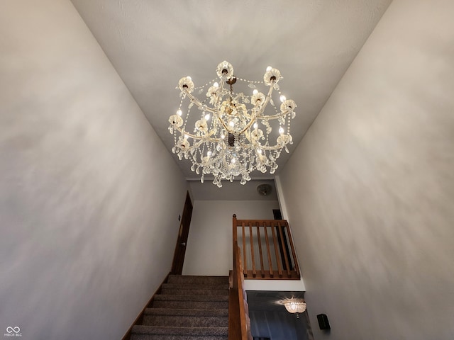 1026 Summer Way Dr, Shelbyville, IN 46176 - stairway featuring a chandelier