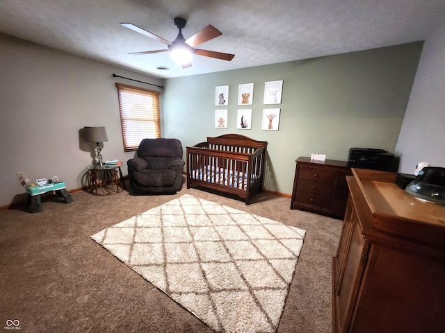 1026 Summer Way Dr, Shelbyville, IN 46176 - bedroom featuring light colored carpet, a crib, baseboards, and ceiling fan