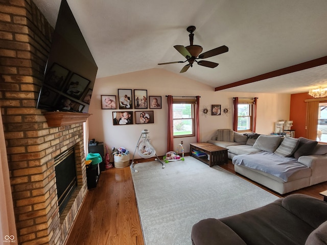 1026 Summer Way Dr, Shelbyville, IN 46176 - living room with a fireplace, wood finished floors, healthy amount of natural light, a ceiling fan, and vaulted ceiling
