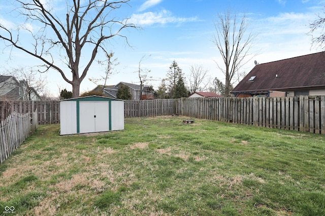 view of yard featuring a storage shed and an outdoor structure
