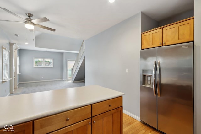 455 S Pine St Unit 4, Indianapolis, IN 46203 - kitchen with stainless steel fridge, a ceiling fan, baseboards, light countertops, and open floor plan