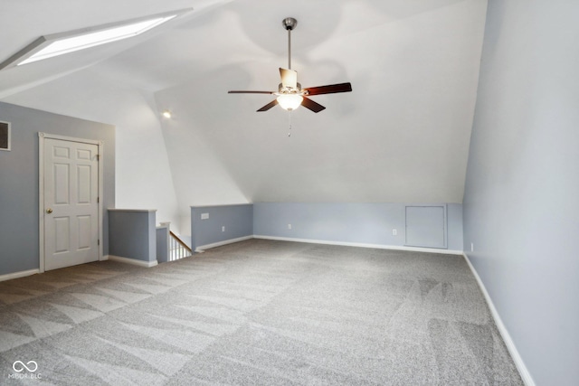 455 S Pine St Unit 4, Indianapolis, IN 46203 - bonus room with vaulted ceiling, carpet floors, a skylight, a ceiling fan, and baseboards