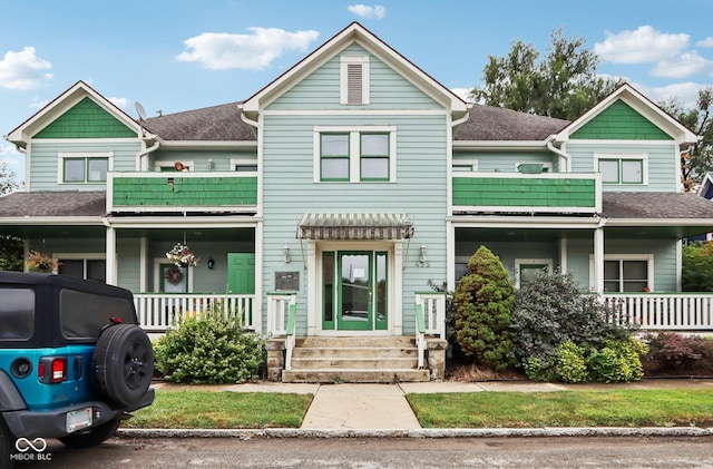 455 S Pine St Unit 4, Indianapolis, IN 46203 - view of front of home with a porch, a balcony, roof with shingles, and entry steps
