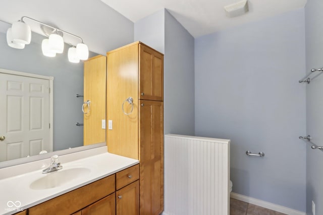 455 S Pine St Unit 4, Indianapolis, IN 46203 - bathroom featuring tile patterned floors, vanity, toilet, and baseboards