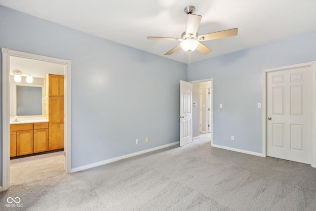 455 S Pine St Unit 4, Indianapolis, IN 46203 - unfurnished bedroom with carpet floors, baseboards, ensuite bathroom, and a ceiling fan