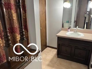 8835 Winding Ridge Rd, Indianapolis, IN 46217 - bathroom featuring vanity and tile patterned flooring