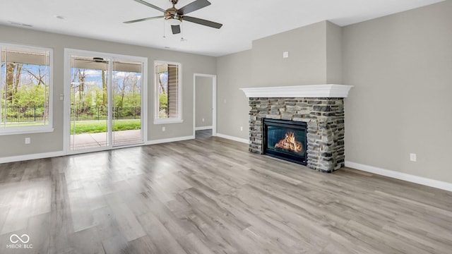 3583 Collier Dr, Lafayette, IN 47905 - unfurnished living room with ceiling fan, a fireplace, baseboards, and wood finished floors