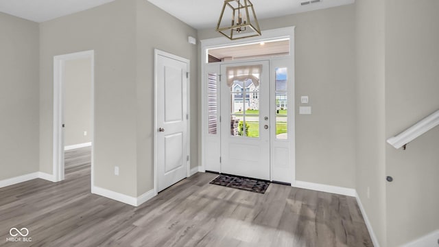 3583 Collier Dr, Lafayette, IN 47905 - foyer entrance featuring wood finished floors, baseboards, and a chandelier