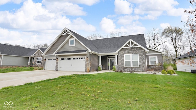 3583 Collier Dr, Lafayette, IN 47905 - craftsman-style house featuring stone siding, a front lawn, concrete driveway, and an attached garage