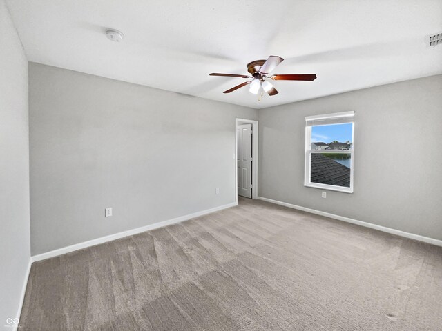 1276 Sanderling Dr, Greenwood, IN 46143 - carpeted empty room with ceiling fan, baseboards, and a smoke detector