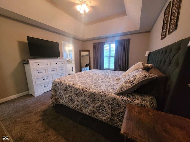 1714 Michelle Mnr, Danville, IN 46122 - bedroom featuring dark colored carpet, baseboards, a raised ceiling, and ceiling fan