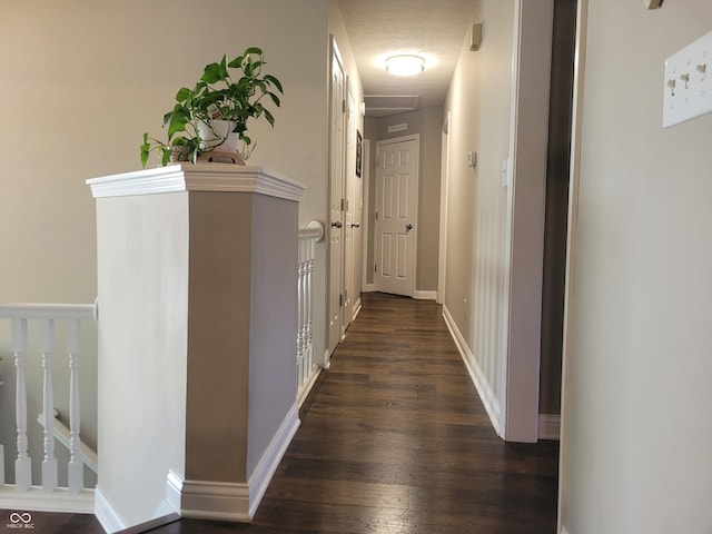 1714 Michelle Mnr, Danville, IN 46122 - hall featuring dark wood-style flooring and a textured ceiling
