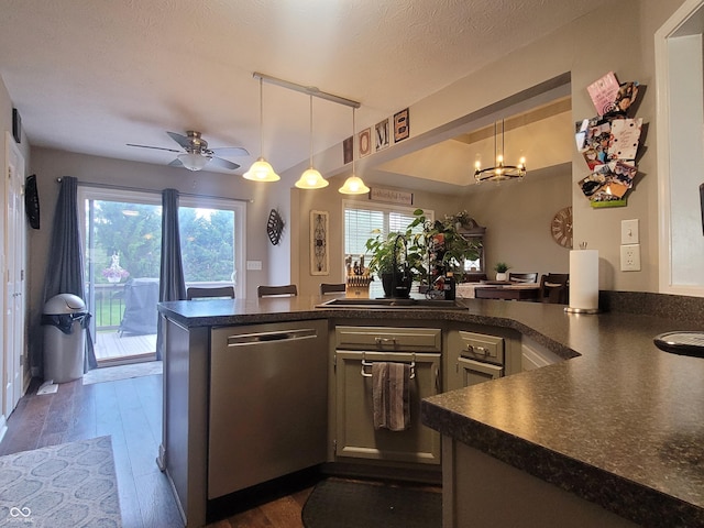 1714 Michelle Mnr, Danville, IN 46122 - kitchen featuring stainless steel dishwasher, dark countertops, a chandelier, a peninsula, and a ceiling fan