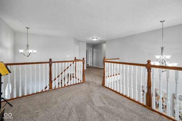 3449 Brixford Ln, West Lafayette, IN 47906 - hallway with a chandelier, carpet, an upstairs landing, baseboards, and a textured ceiling