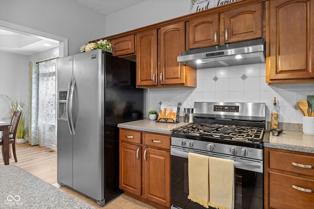 3449 Brixford Ln, West Lafayette, IN 47906 - kitchen with appliances with stainless steel finishes, under cabinet range hood, backsplash, and brown cabinetry