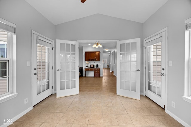 3449 Brixford Ln, West Lafayette, IN 47906 - foyer with french doors, lofted ceiling, light tile patterned floors, baseboards, and a chandelier