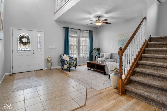 3449 Brixford Ln, West Lafayette, IN 47906 - foyer entrance featuring stairway, ceiling fan, and baseboards
