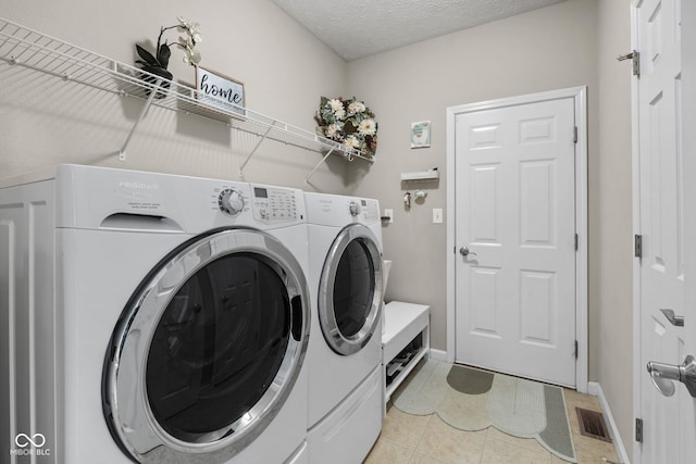 3449 Brixford Ln, West Lafayette, IN 47906 - laundry room with washer and dryer, baseboards, and light tile patterned flooring