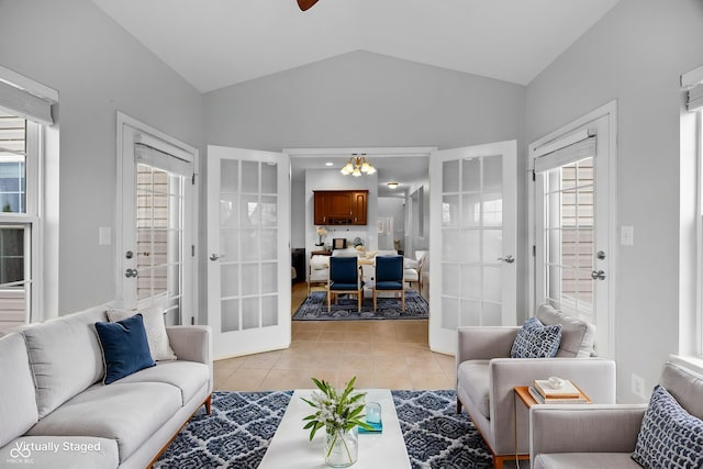 3449 Brixford Ln, West Lafayette, IN 47906 - living room featuring vaulted ceiling, light tile patterned floors, and a chandelier