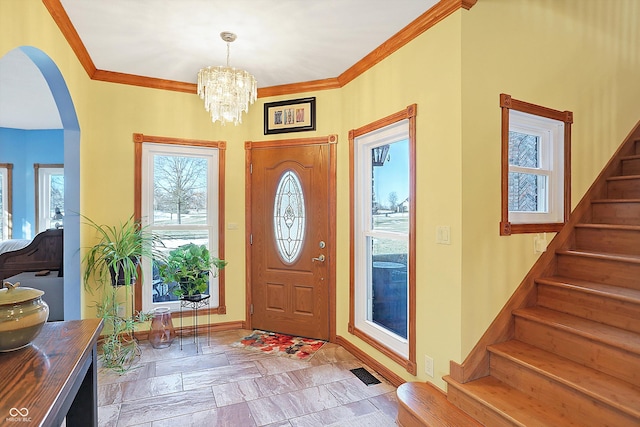 186 W 600 N, Alexandria, IN 46001 - foyer with stairway, arched walkways, a chandelier, crown molding, and baseboards