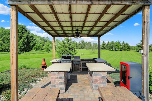 186 W 600 N, Alexandria, IN 46001 - view of patio with ceiling fan, a grill, and view of wooded area