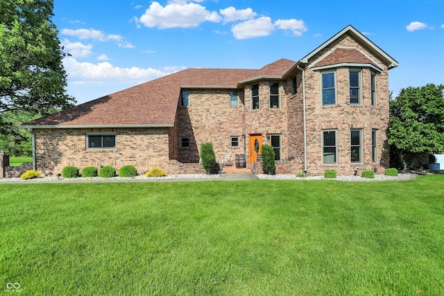186 W 600 N, Alexandria, IN 46001 - view of front of property featuring a front lawn, brick siding, and roof with shingles