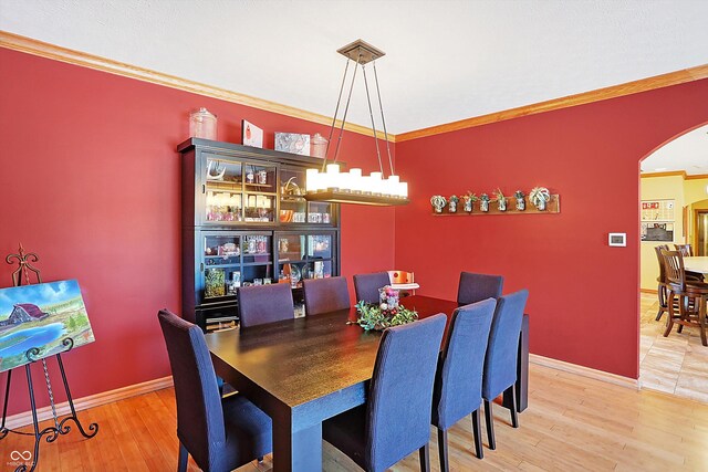 186 W 600 N, Alexandria, IN 46001 - dining area with arched walkways, wood finished floors, ornamental molding, and baseboards