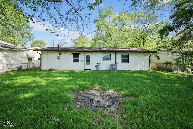 611 Hampton Ln, Anderson, IN 46017 - back of house featuring central AC and board and batten siding