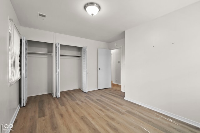 611 Hampton Ln, Anderson, IN 46017 - unfurnished bedroom with light wood finished floors and baseboards